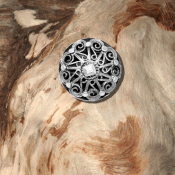Oxidized haystack button with “demant”